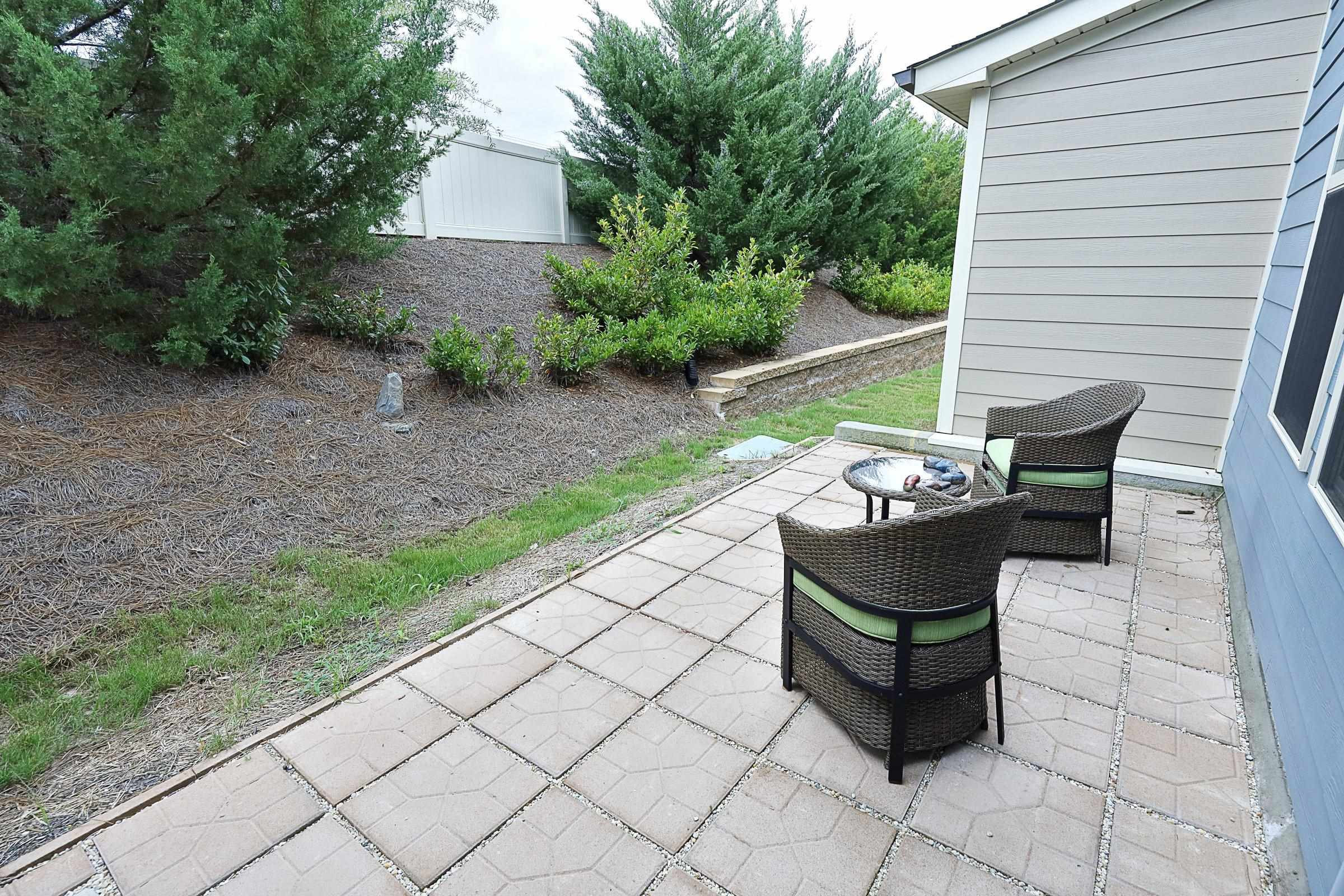 1241 Catch Fly Lane Durham, NC 27713 - Photo 35 of 44 a wooden bench sitting in backyard of the house