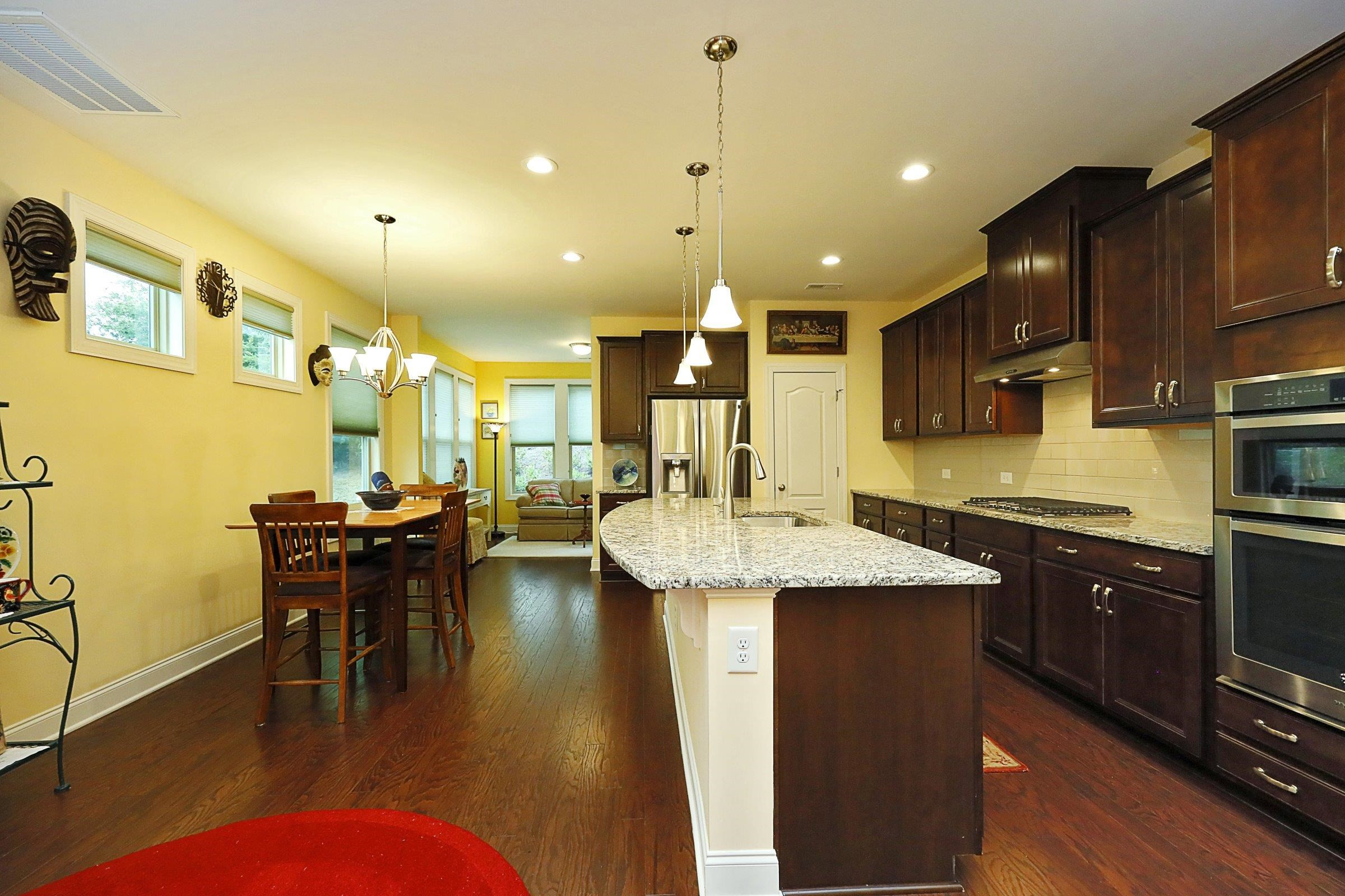 1241 Catch Fly Lane Durham, NC 27713 - Photo 7 of 44 a kitchen with lots of counter top space and dining table
