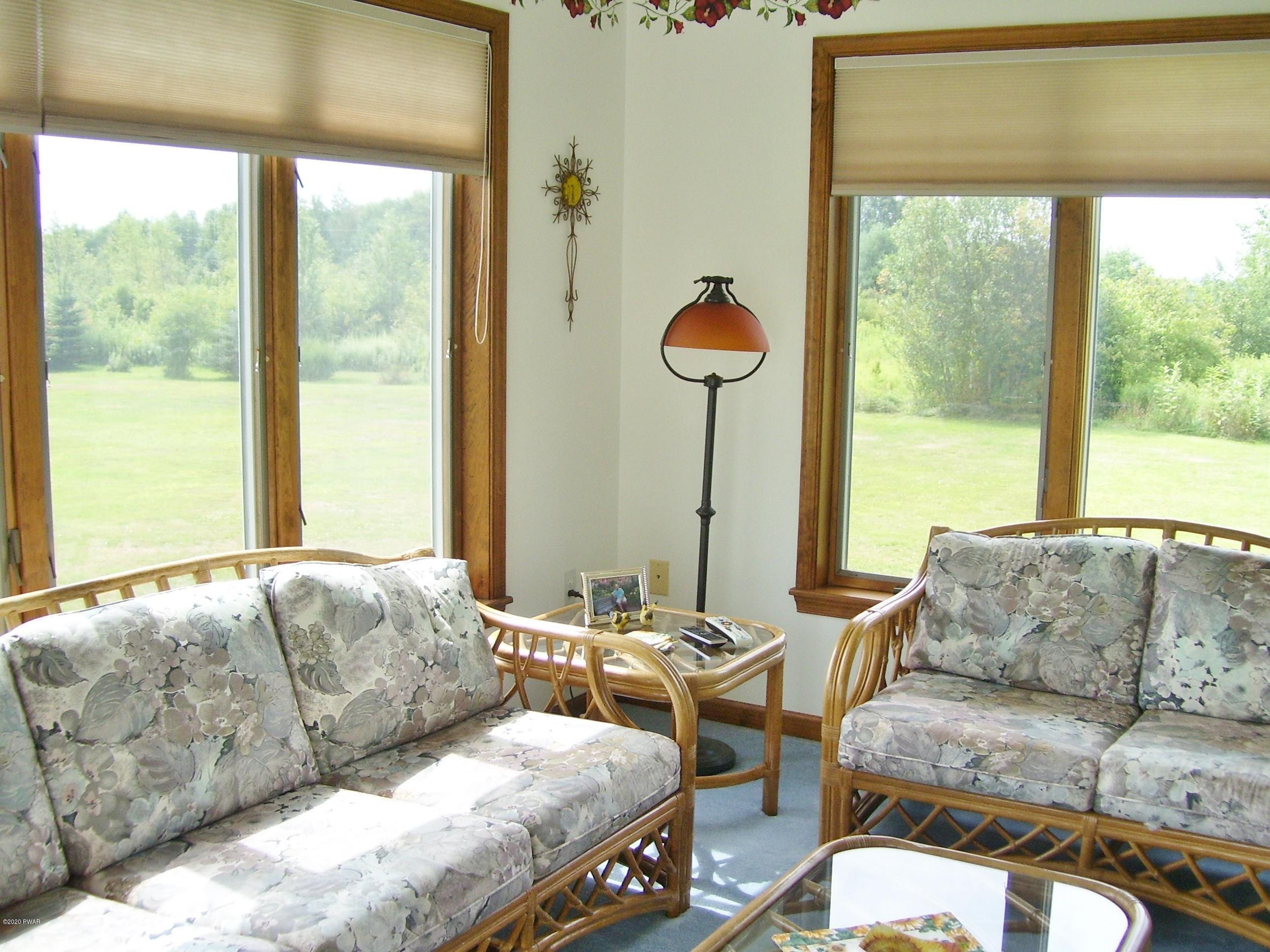 50 Layton Road Waymart, PA 18472 - Photo 22 of 61 a living room with furniture and a large window