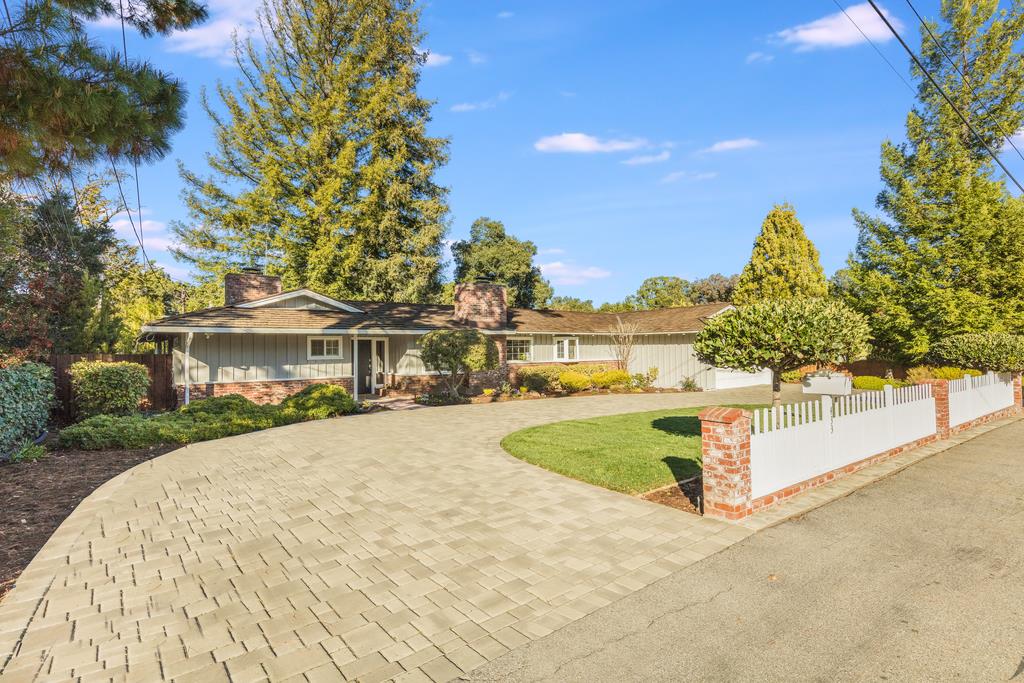 433 Yerba Buena Avenue Los Altos, CA 94022 - Photo 1 of 39 a view of a white house with a yard and potted plants