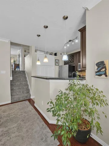 a kitchen with kitchen island a counter top space and wooden floor