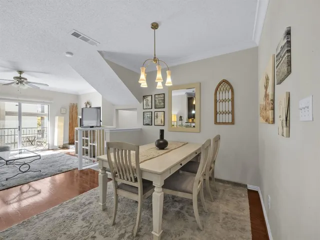 a view of a dining room with furniture and window