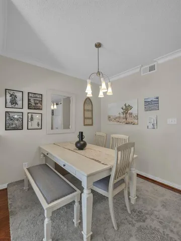 a kitchen with stainless steel appliances granite countertop a sink stove cabinets and microwave