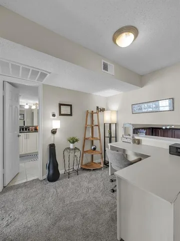 a room with furniture and white walls