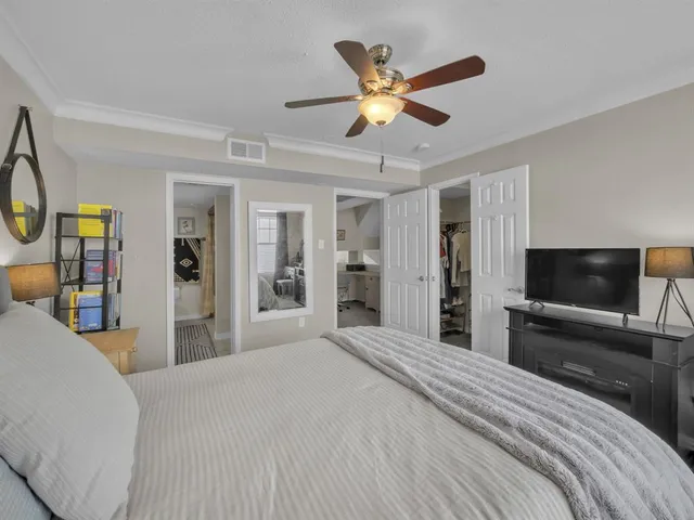 a bedroom with a bed furniture and a window