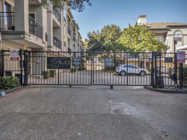 a view of a garden with a building