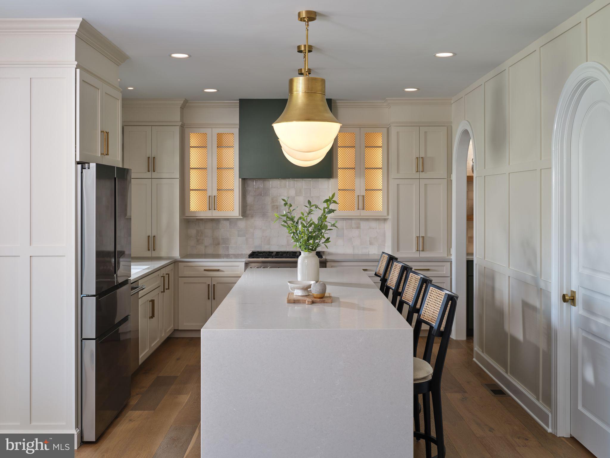 6 Inverness Drive Medford, NJ 08055 - Photo 12 of 62 a kitchen with stainless steel appliances a dining table chairs and granite counter tops