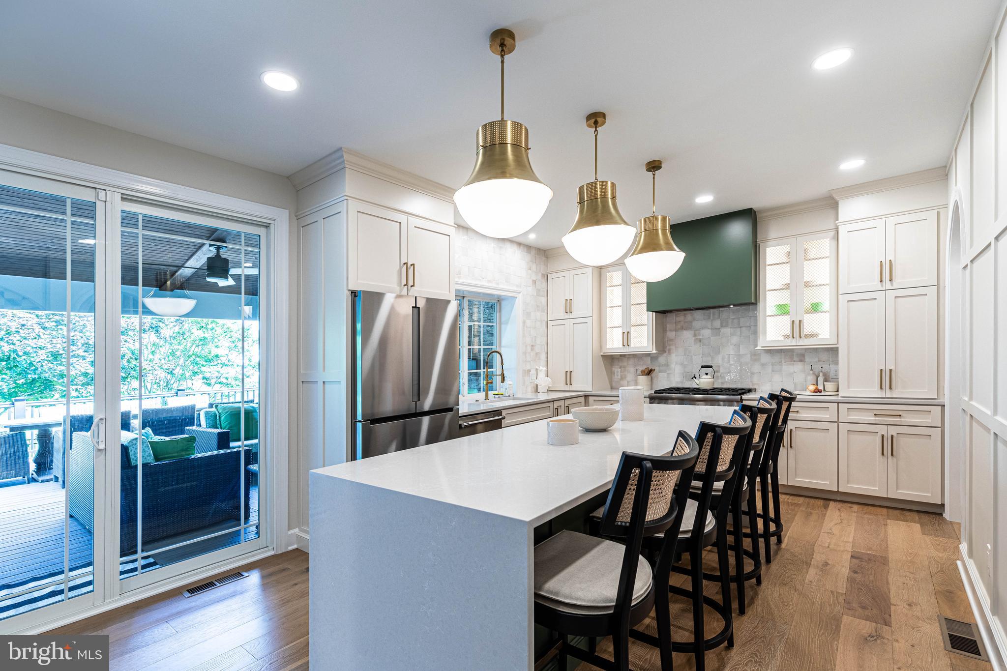 6 Inverness Drive Medford, NJ 08055 - Photo 17 of 62 a kitchen with stainless steel appliances granite countertop a stove a kitchen island a dining table and chairs