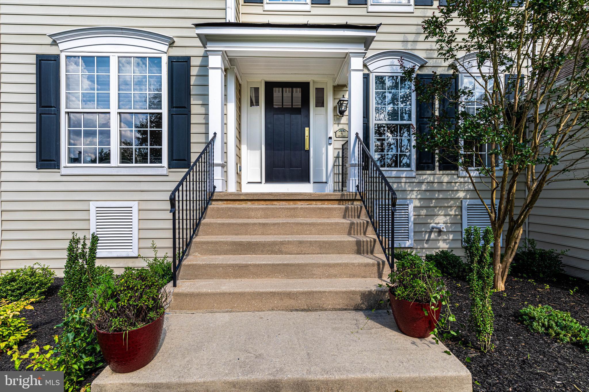 6 Inverness Drive Medford, NJ 08055 - Photo 2 of 62 a front view of a house with a garden