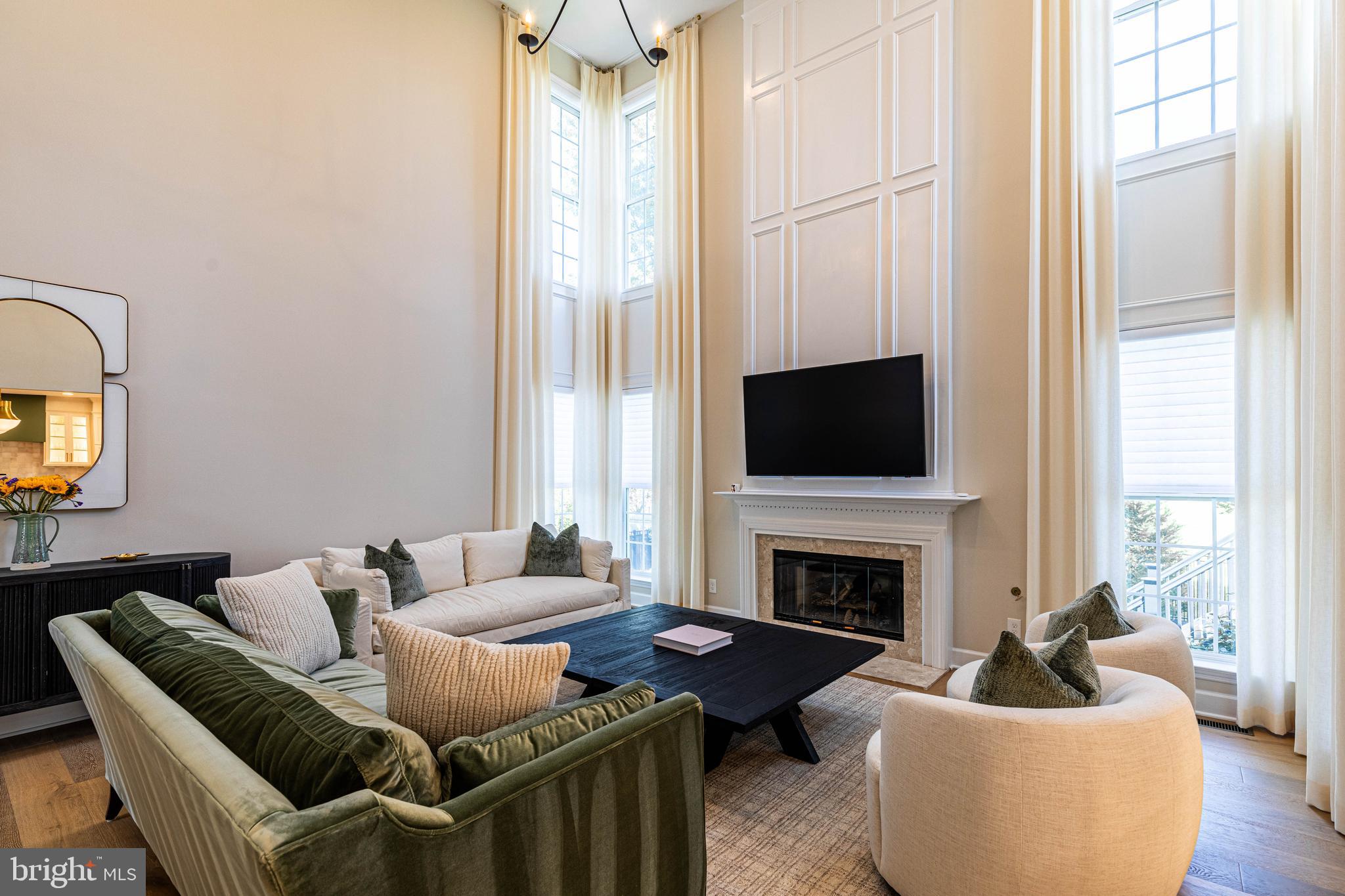 6 Inverness Drive Medford, NJ 08055 - Photo 26 of 62 a living room with furniture a flat screen tv and a fireplace