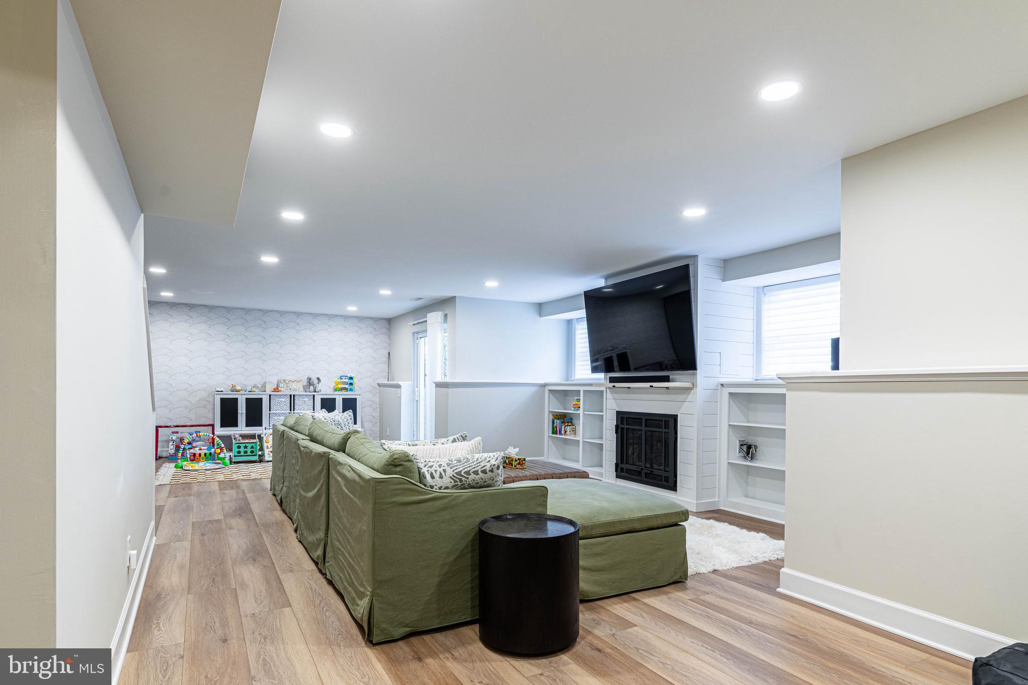 6 Inverness Drive Medford, NJ 08055 - Photo 46 of 62 a living room with furniture a flat screen tv and kitchen view