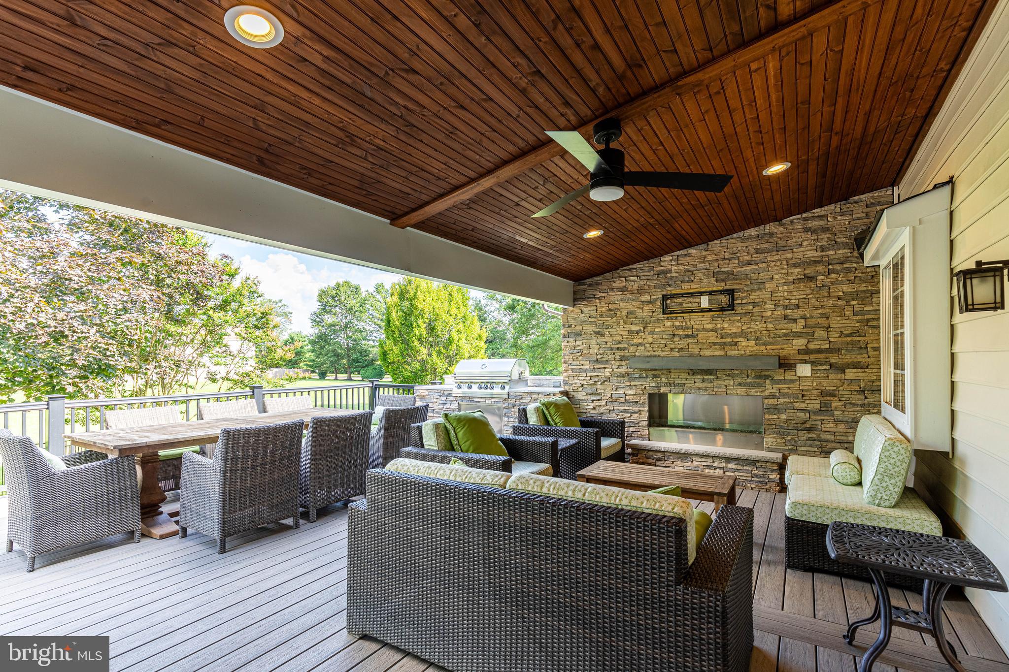6 Inverness Drive Medford, NJ 08055 - Photo 54 of 62 a living room with patio furniture and a fireplace