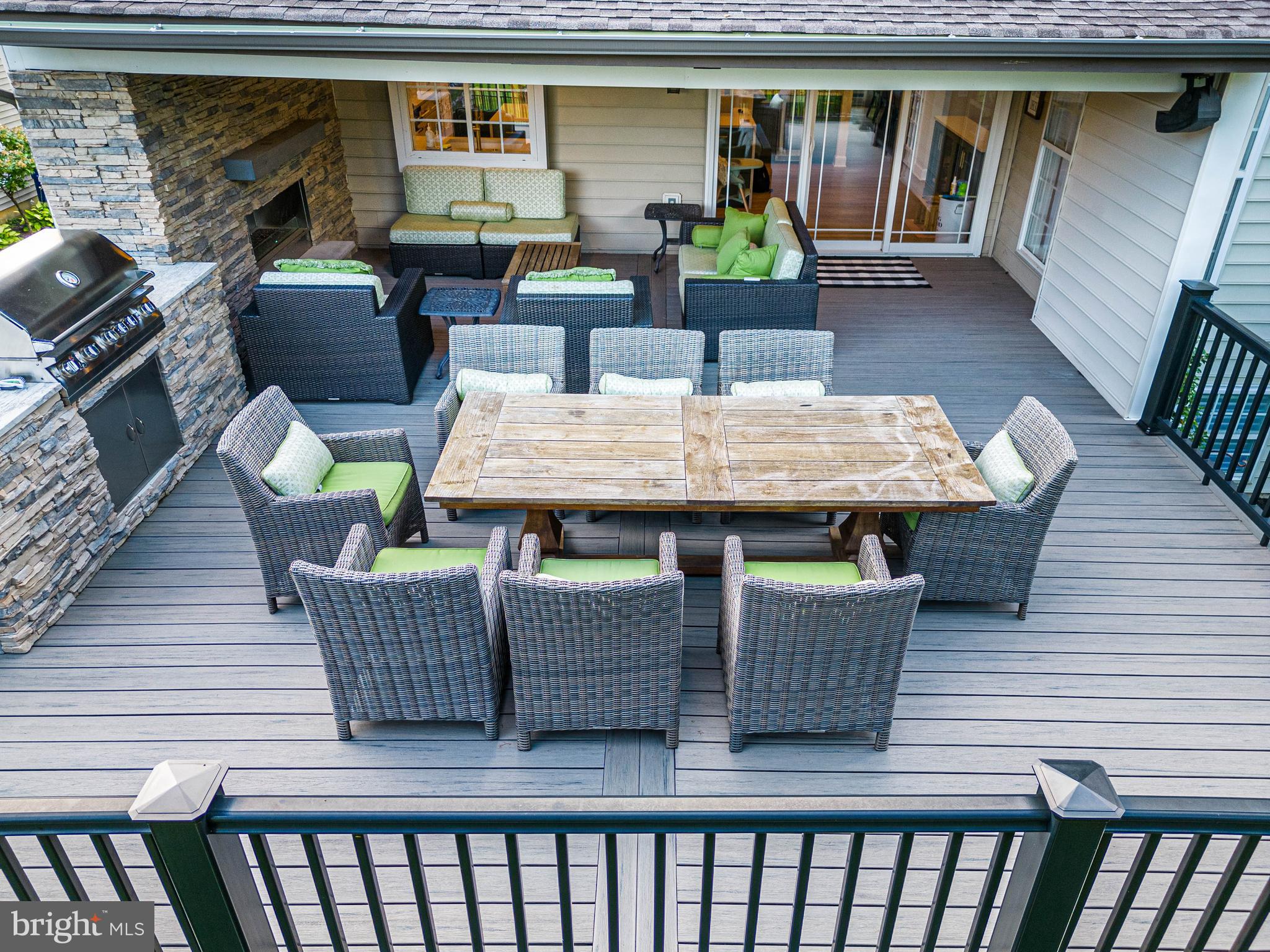 6 Inverness Drive Medford, NJ 08055 - Photo 59 of 62 a view of a patio with couches chairs potted plants and wooden floor