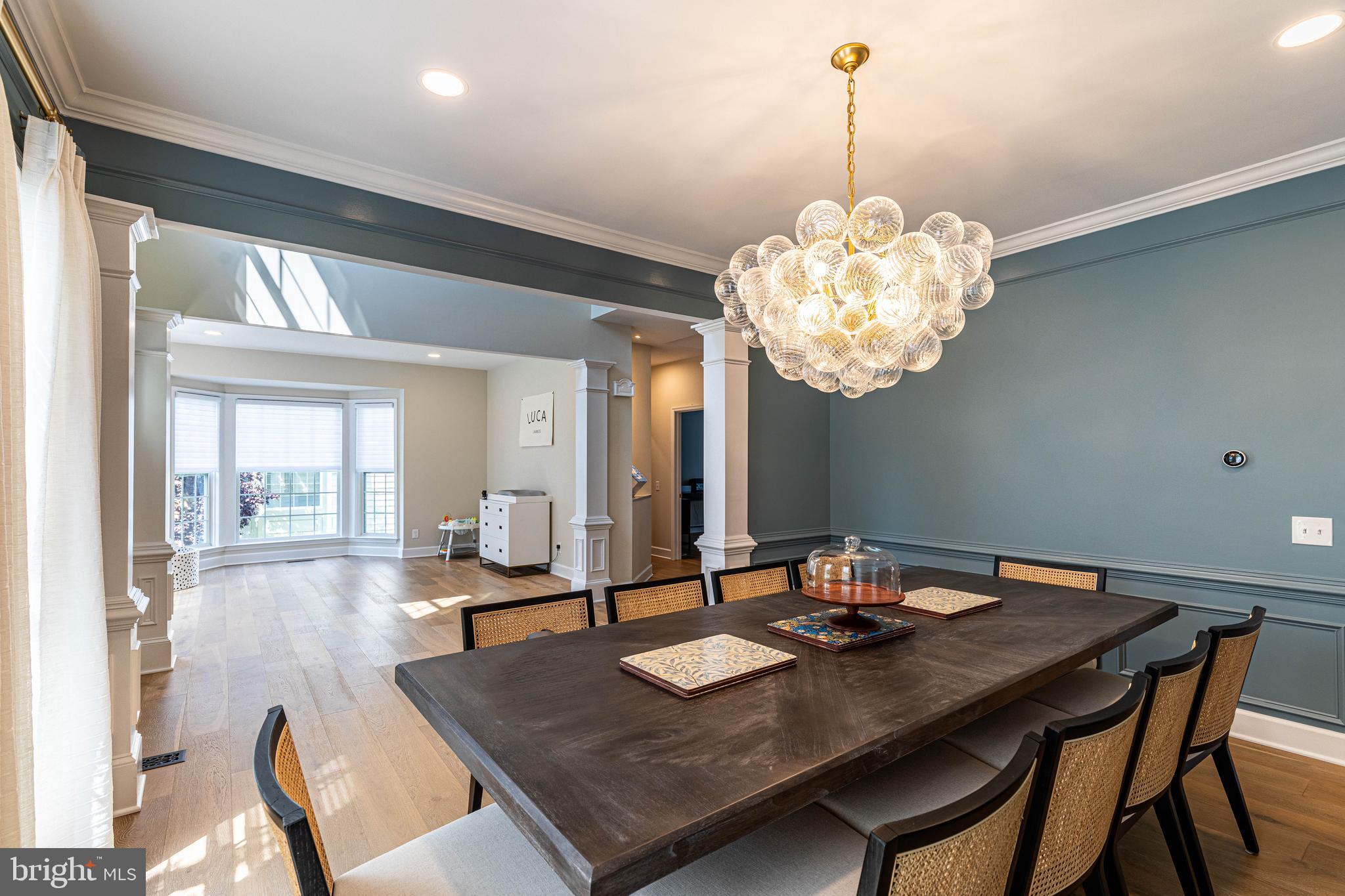 6 Inverness Drive Medford, NJ 08055 - Photo 7 of 62 a dining room with a table or chairs and a dining table with garden view
