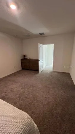 a bathroom with a granite countertop toilet and a shower