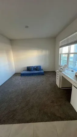 a view of an house with backyard space and garden