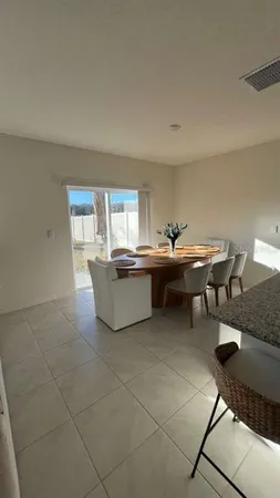 a room with a table chairs and a couch