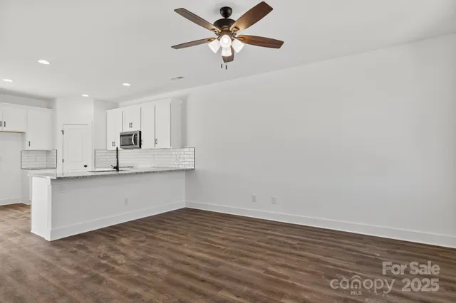 a view of kitchen with wooden floor