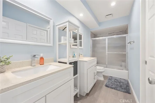 a bedroom with a bed and a table