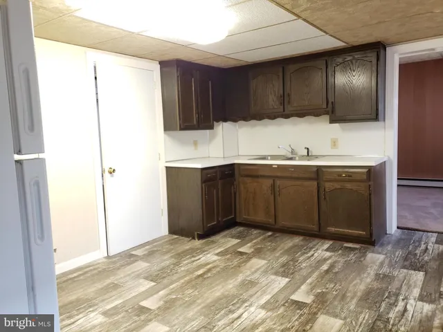 a kitchen with a sink and cabinets