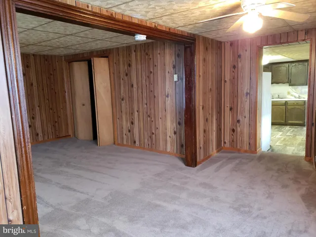 a view of a room with a wooden door