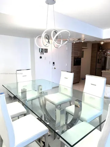 a bathroom with a sink mirror and vanity