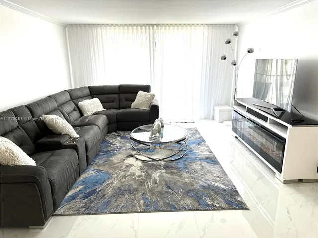 a living room with furniture and a couch