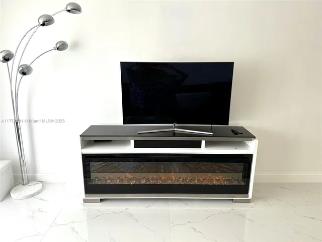 a living room with a sink and a toilet