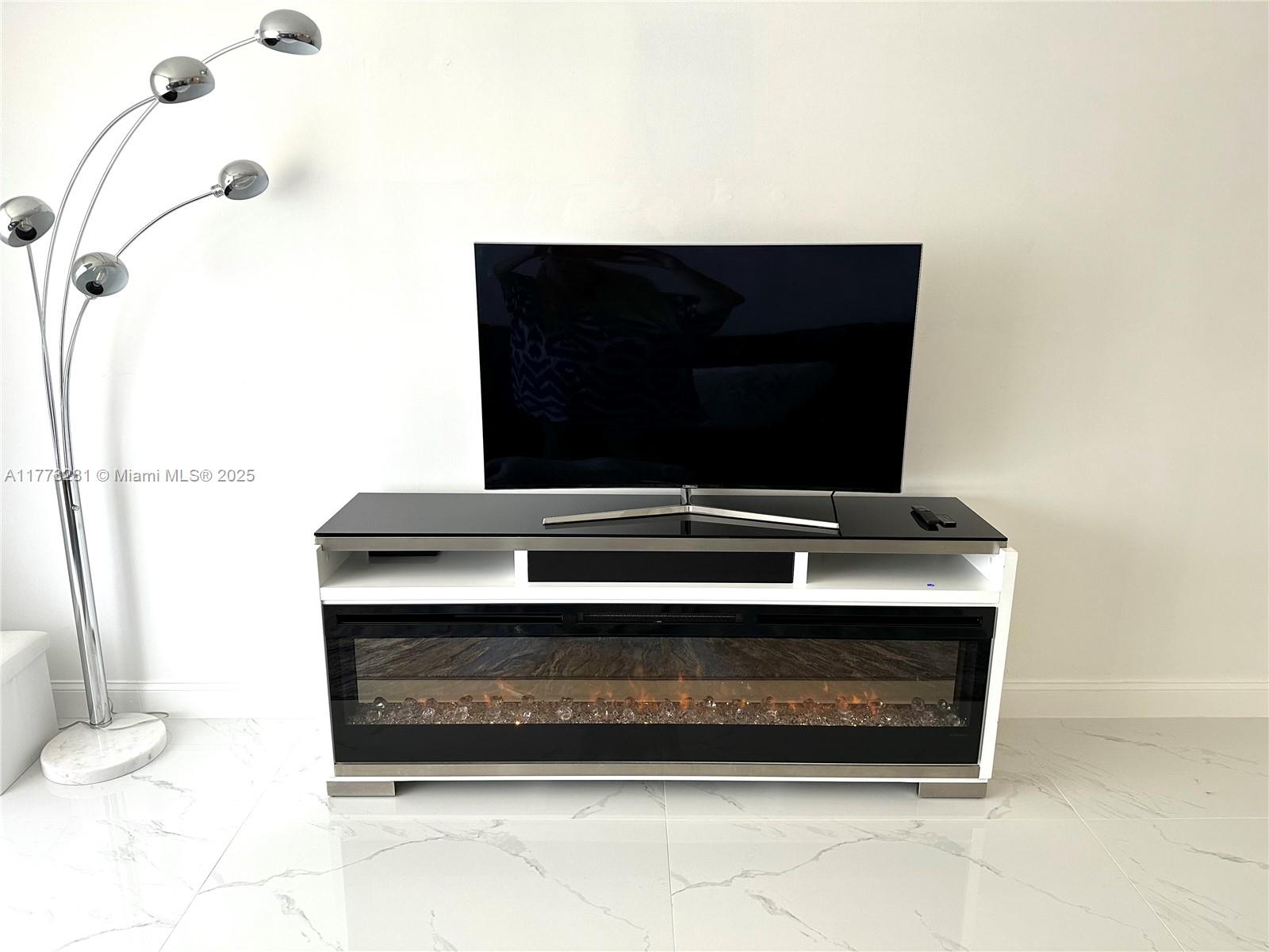 427 Golden Isles Drive, Unit 5G Hallandale Beach, FL 33009 - Photo 12 of 35 a living room with a sink and a toilet