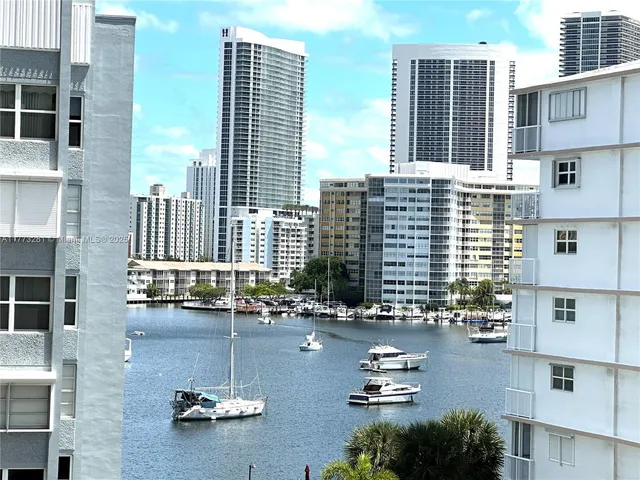 a swimming pool view with a outdoor seating