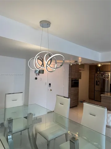 a view of a livingroom with furniture and a ceiling fan