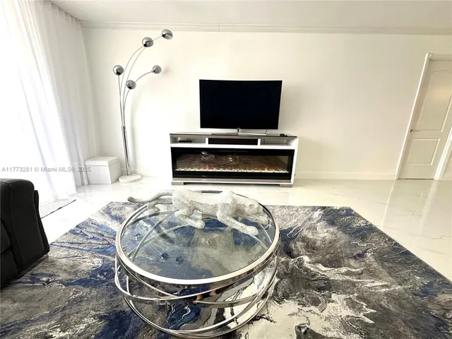 a living room with a couch and a flat screen tv