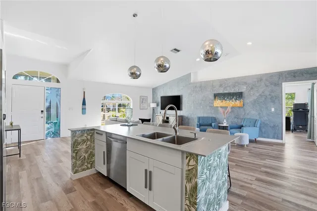 a living room with furniture and a flat screen tv