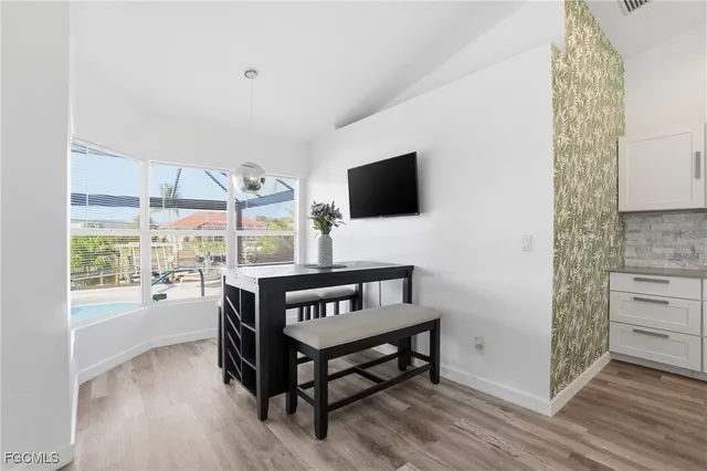 a bedroom with a bed and a mirror