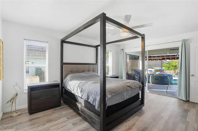 a bedroom with a bed and a television