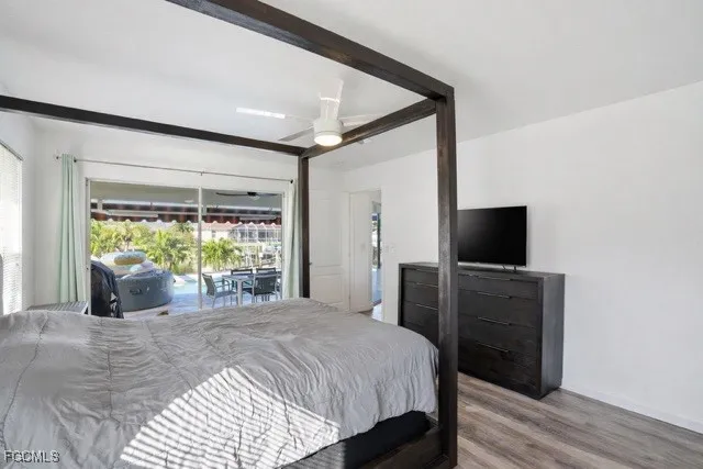 a bedroom with a bed and a mirror