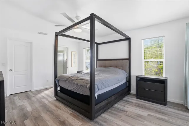 a bathroom with a double vanity sink mirror and shower