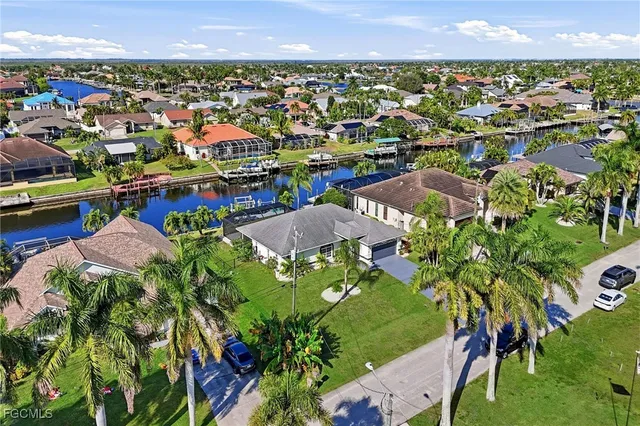 an entryway view with wooden floor and cabinet
