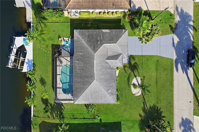 a view of a lake with a patio and a yard