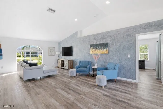 a living room with furniture and a flat screen tv