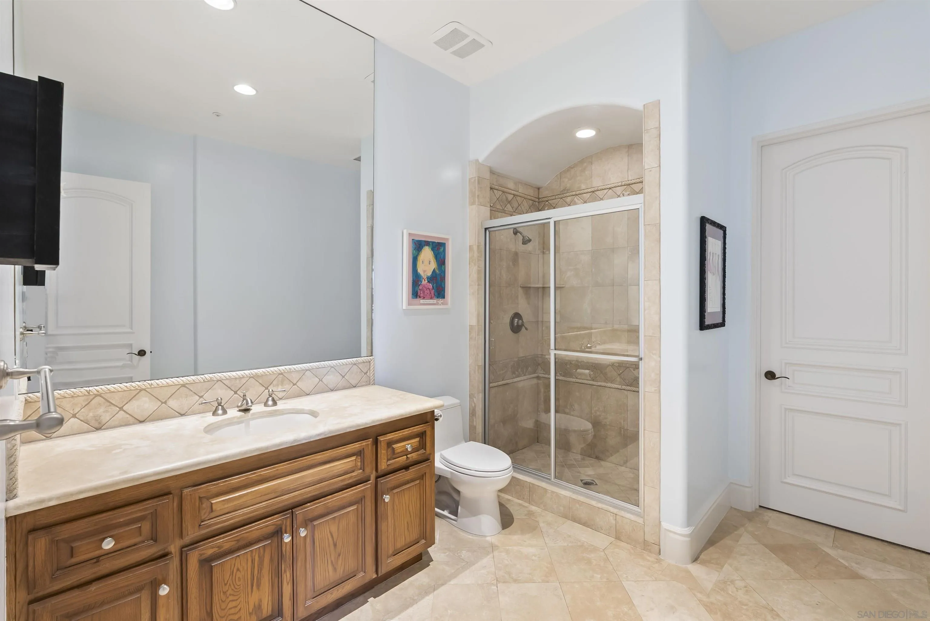 14480 Bellvista Drive Rancho Santa Fe, CA 92067 - Photo 23 of 28 a bathroom with a sink a toilet and shower