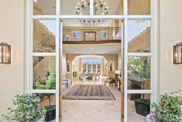 a dining room with furniture a fireplace and wooden floor