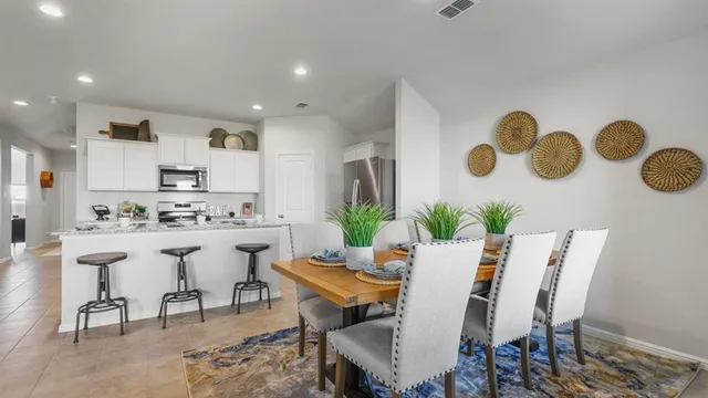 a kitchen with stainless steel appliances granite countertop a stove and a sink