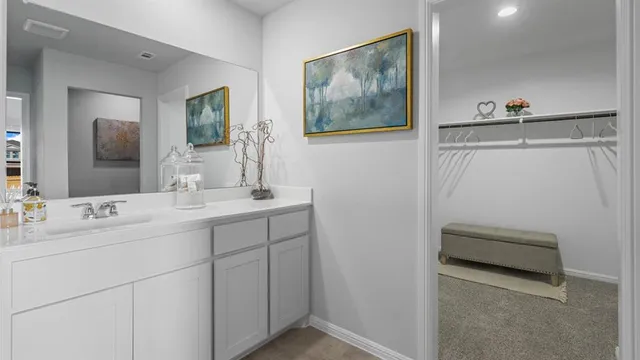 a bathroom with a shower and a mirror
