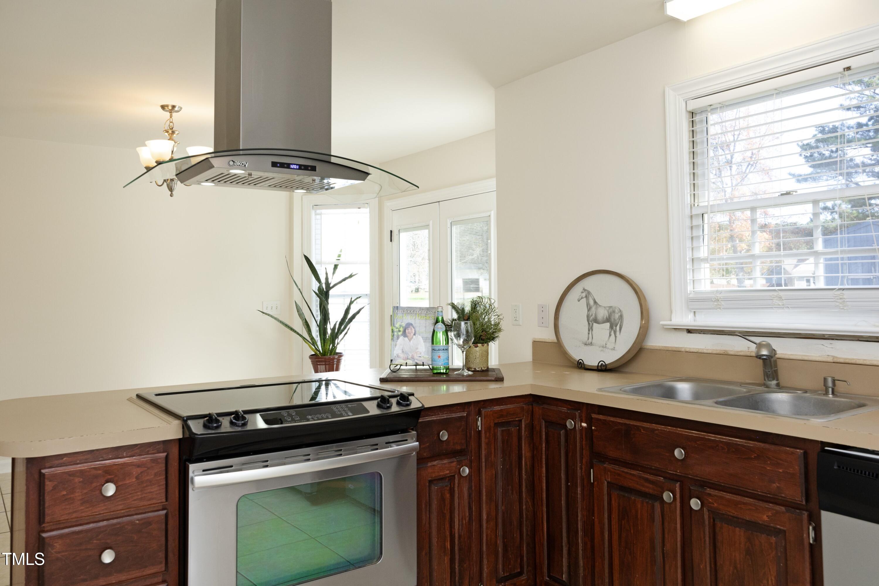 101 Ryans Run Youngsville, NC 27596 - Photo 15 of 33 a kitchen with a stove and a sink
