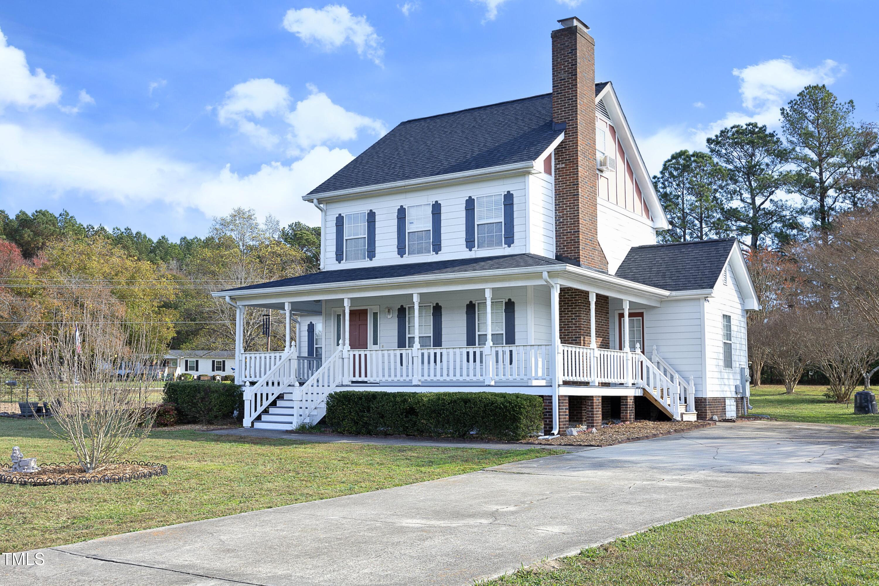 101 Ryans Run Youngsville, NC 27596 - Photo 2 of 33 a front view of a house with a garden