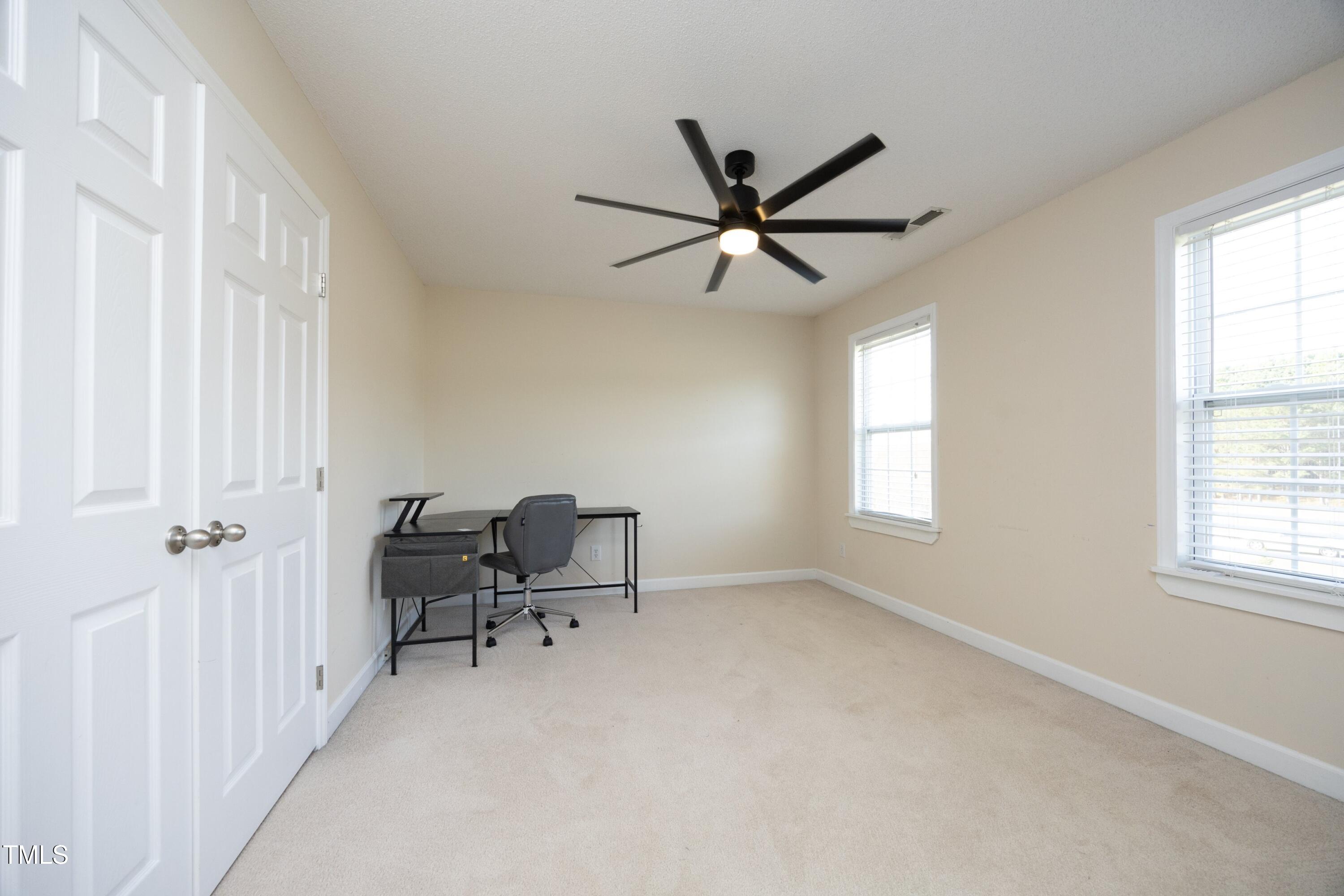 101 Ryans Run Youngsville, NC 27596 - Photo 21 of 33 a view of a workspace with furniture and a window