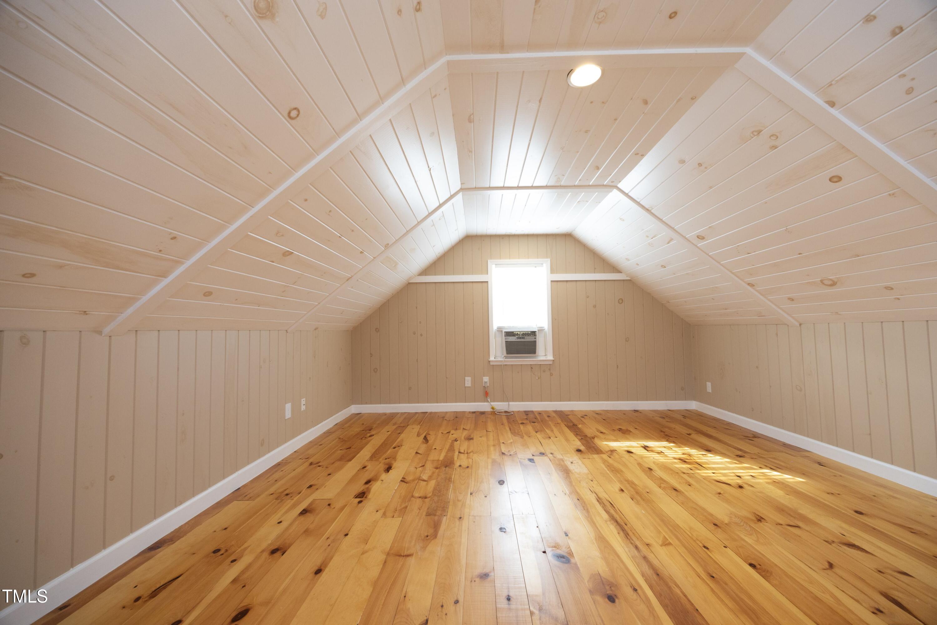 101 Ryans Run Youngsville, NC 27596 - Photo 25 of 33 an empty room with wooden floor and windows