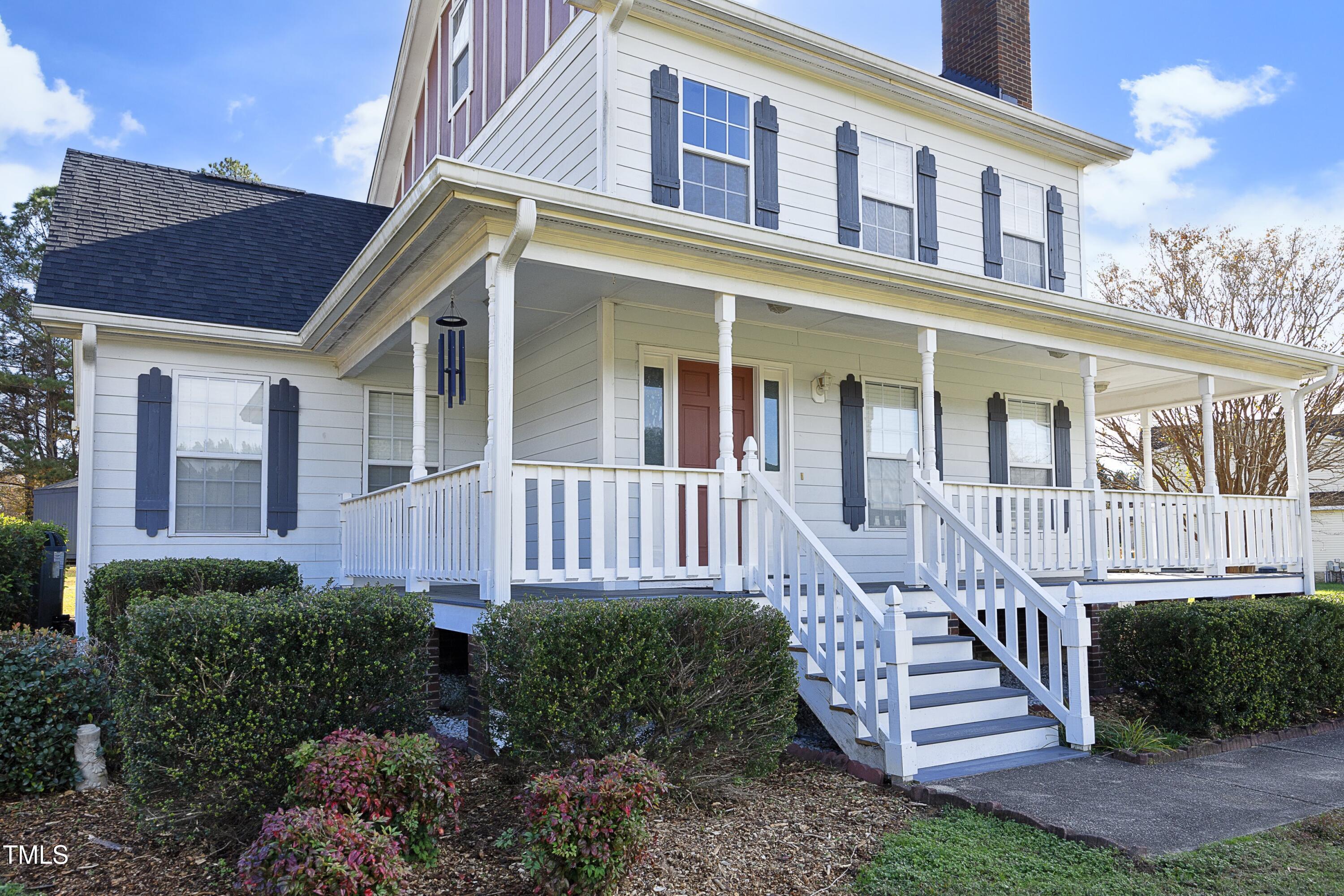 101 Ryans Run Youngsville, NC 27596 - Photo 3 of 33 a view of a house with backyard and porch