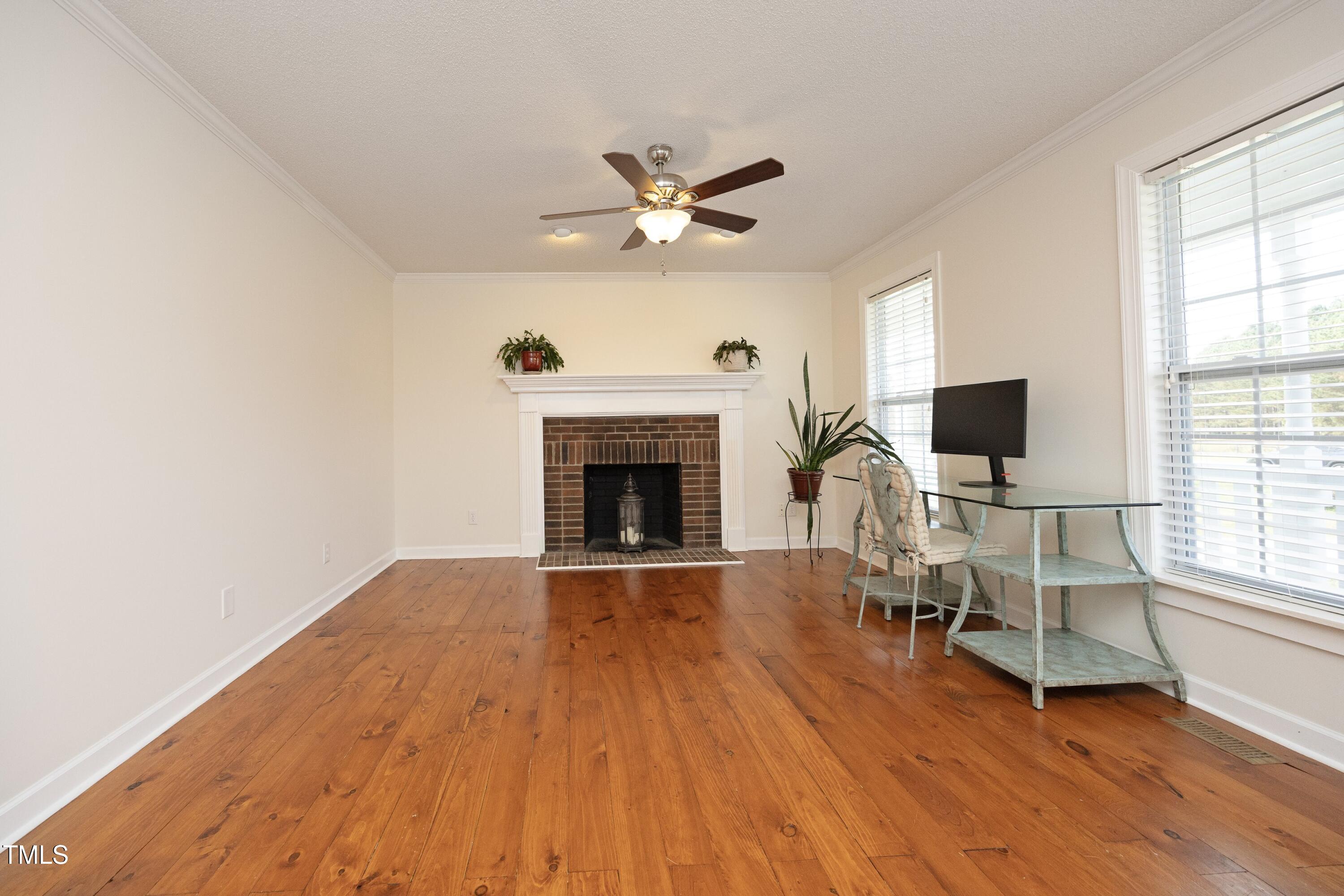 101 Ryans Run Youngsville, NC 27596 - Photo 9 of 33 a living room with furniture fireplace and flat screen tv